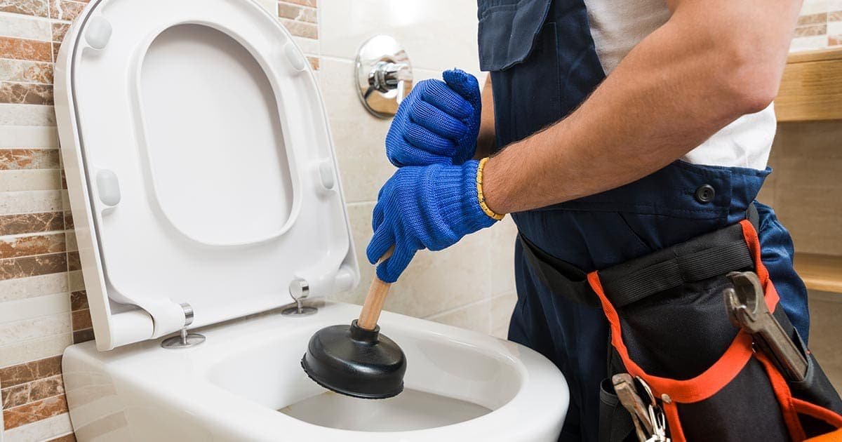South Florida Plumbing plumber performing toilet repair in Fort Lauderdale, FL